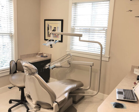 Edgartown Dental group's treatment room with dental chair and equipment.
